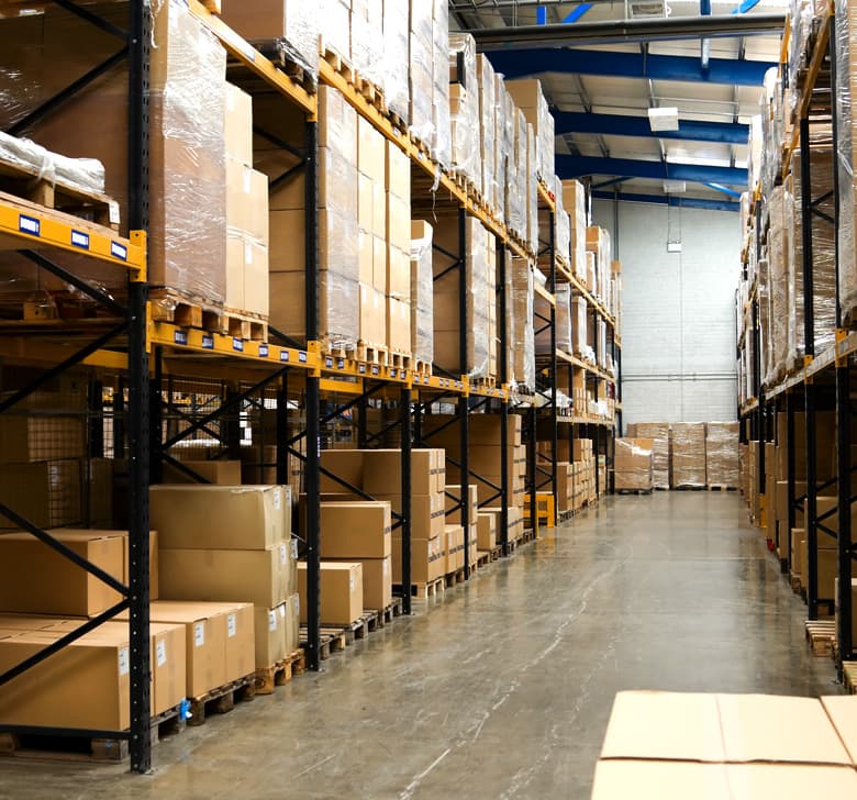 Anjoman products stacked and ready for distribution in the warehouse